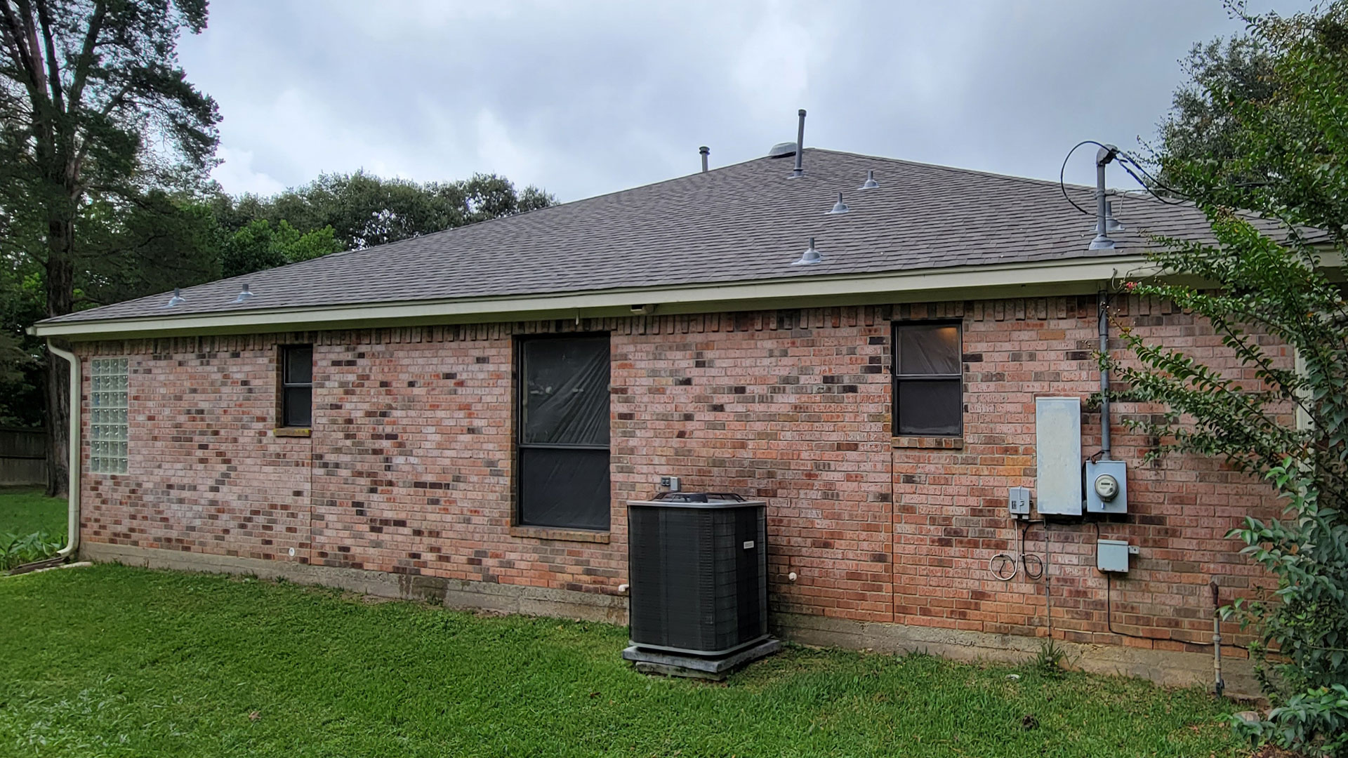 The roofing job showed from the backyard. Certainteed's ClimateFlex® - Colored in weathered wood. And Shadow Ridge® plus Solar Power Attic Vents installed in Tomball, Texas (a city between Cypress and Spring in Northern Houston).